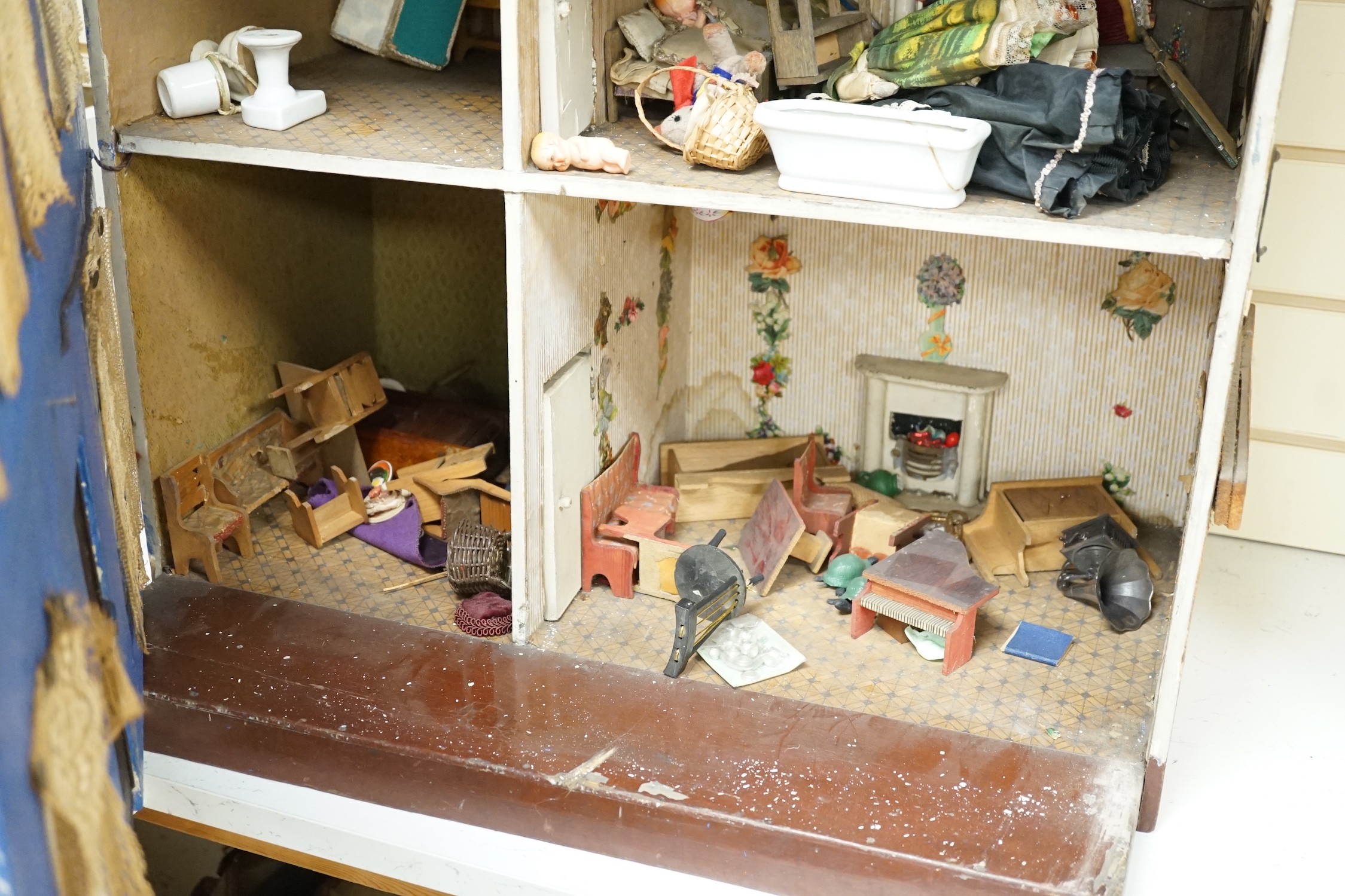 An early 20th century Lines Bros doll’s house, 81cms high x 64cms wide